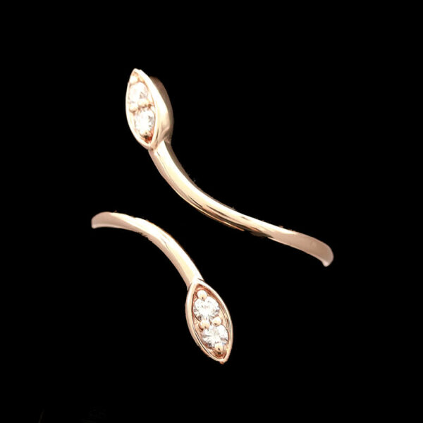 a pair of gold ear clips with diamonds
