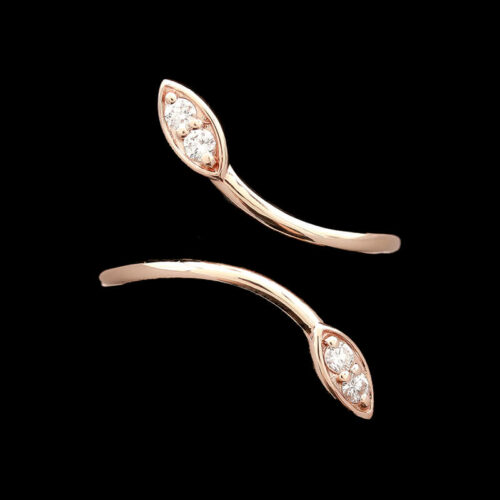 two gold and diamond ear clips