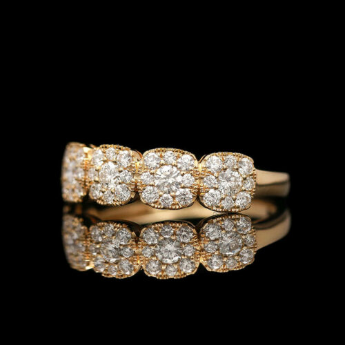 a gold ring with three rows of diamonds