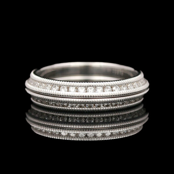 a stack of three rings with diamonds on them