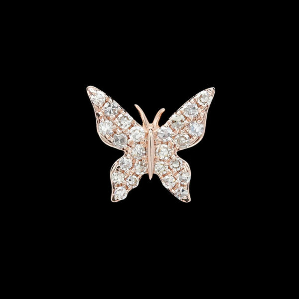 a diamond butterfly broochle on a black background