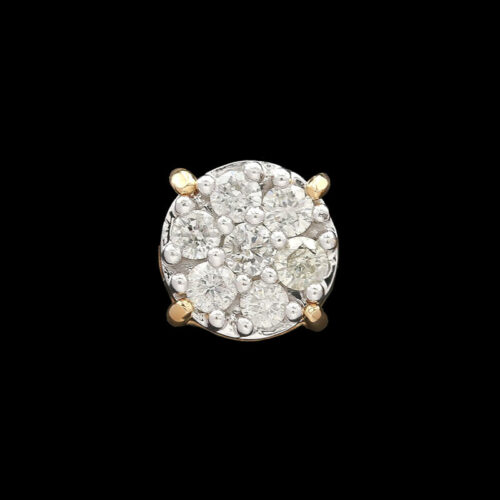 a diamond and gold ring on a black background
