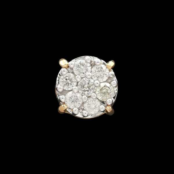 a diamond and gold ring on a black background