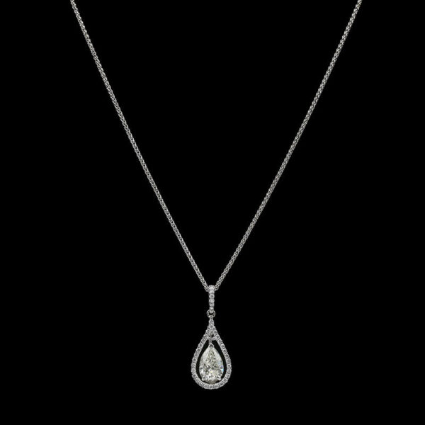 a necklace with a tear shaped diamond on it