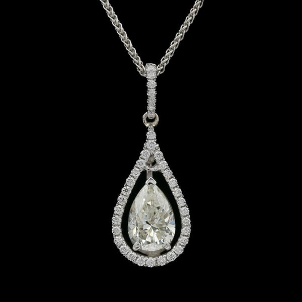 a necklace with a pear shaped diamond on it