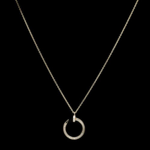 a necklace with a circle pendant on a black background