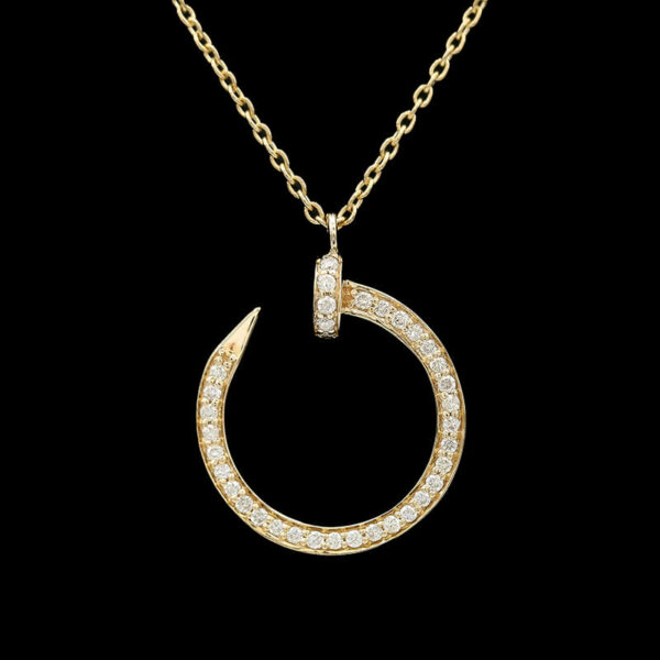 a gold necklace with a crescent and diamonds
