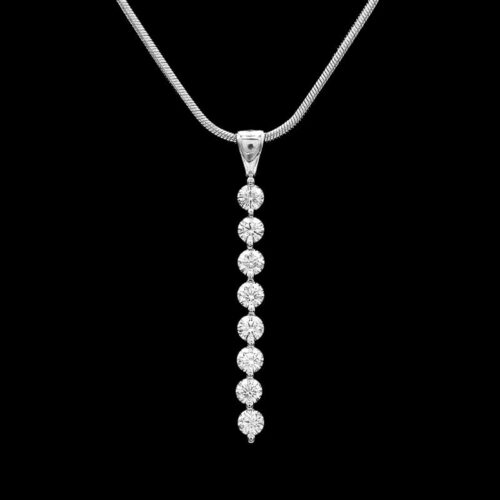 a necklace with three diamonds hanging from it