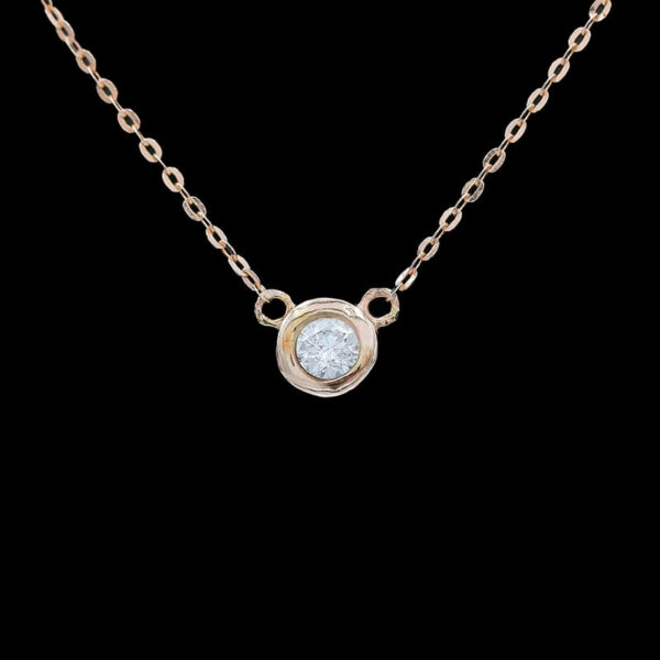 a necklace with a white stone on it