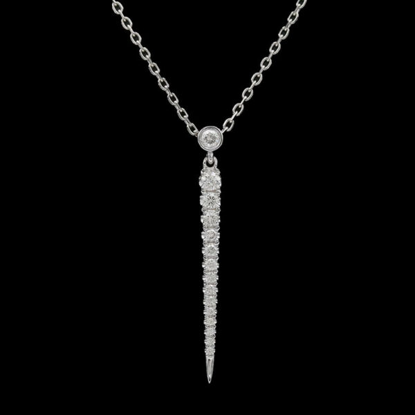 a necklace with a long chain and a diamond on it