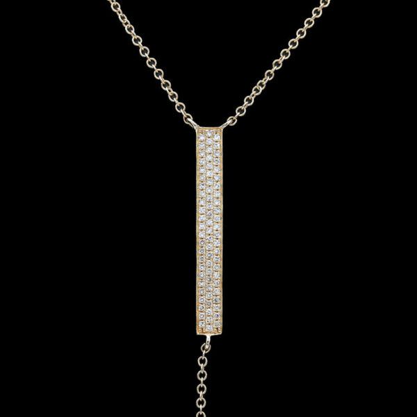 a gold necklace with a long chain