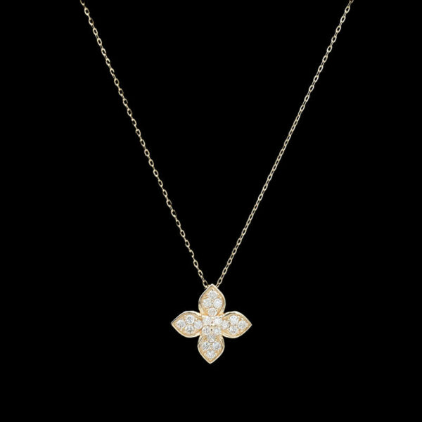 a diamond flower necklace on a black background