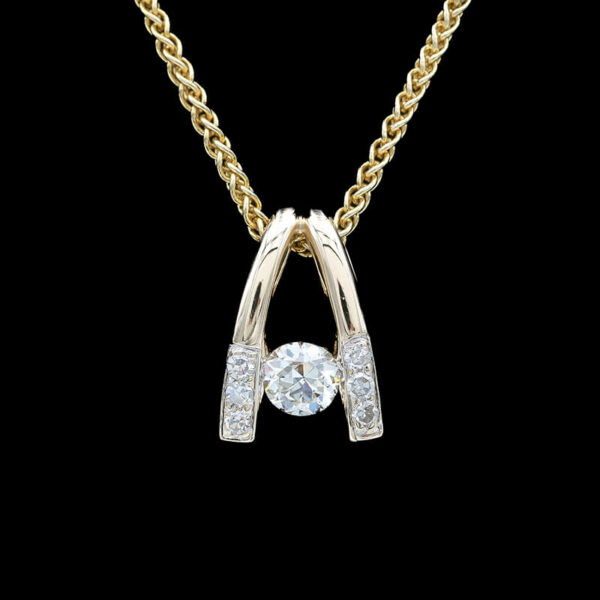 a diamond pendant with two diamonds on it