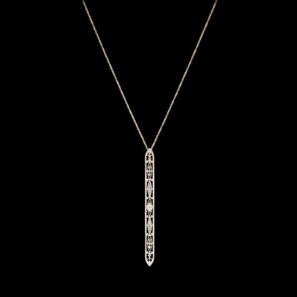 a gold necklace with a diamond bar on it