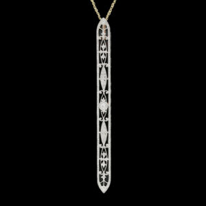 a pendant with an intricate design on it