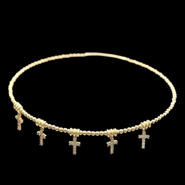 a necklace with three crosses on it