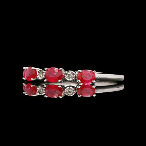 a ring with red stones and white diamonds