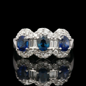 three blue and white diamonds are set in a ring
