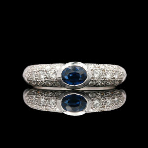 two white gold rings with blue sapphires and diamonds