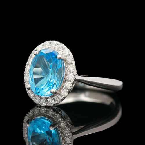 an oval blue topaz and diamond ring