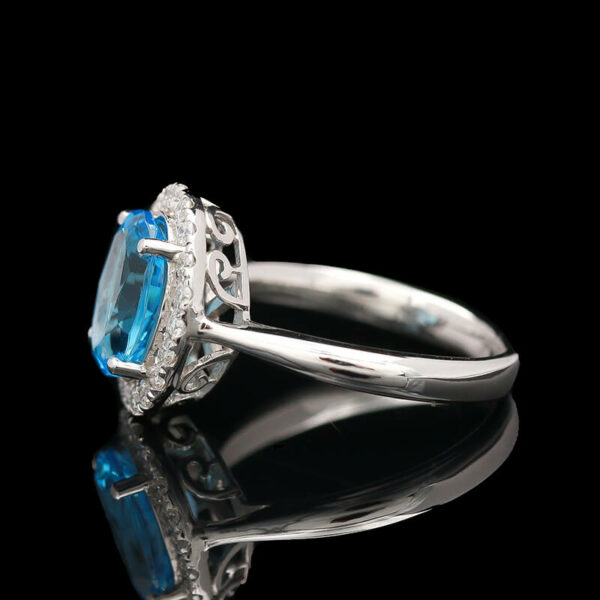 an oval blue topaz and diamond ring