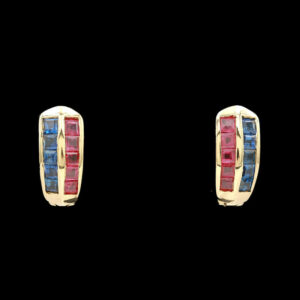 a pair of gold earrings with red, blue and white stones
