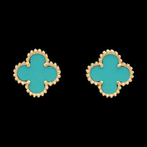 a pair of turquoise and gold earrings