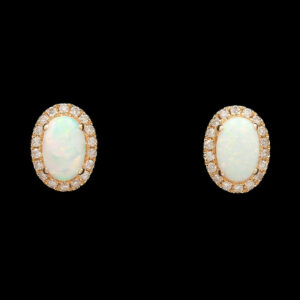 a pair of opal and diamond earrings