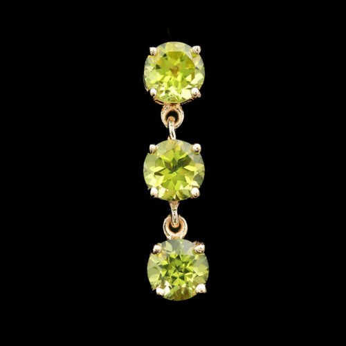 three stone earrings with yellow and green stones