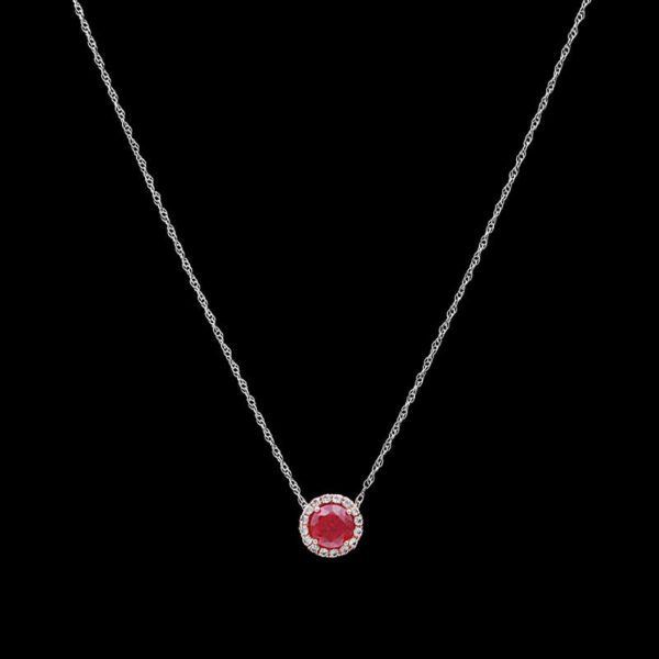 a necklace with a red stone on it