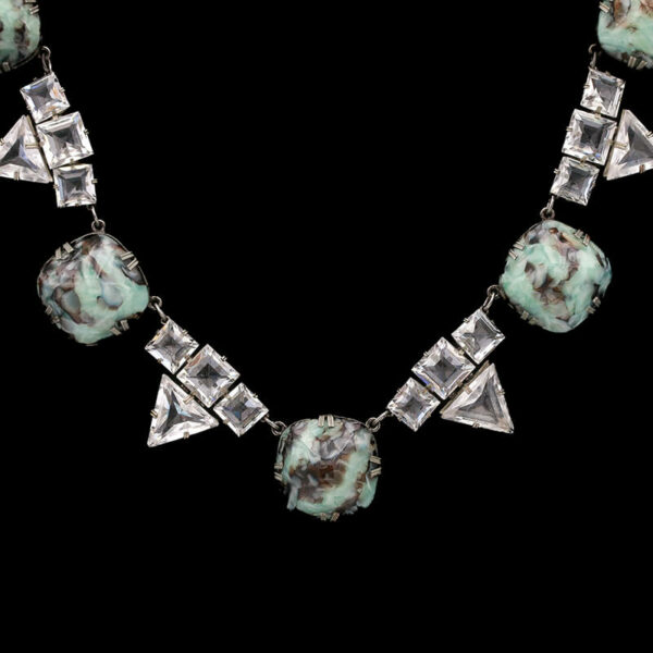 a necklace with several pieces of jewelry on it
