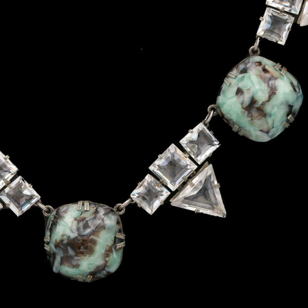 a necklace with two pieces of glass on it