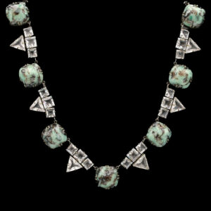 a necklace with silver and turquoise stones