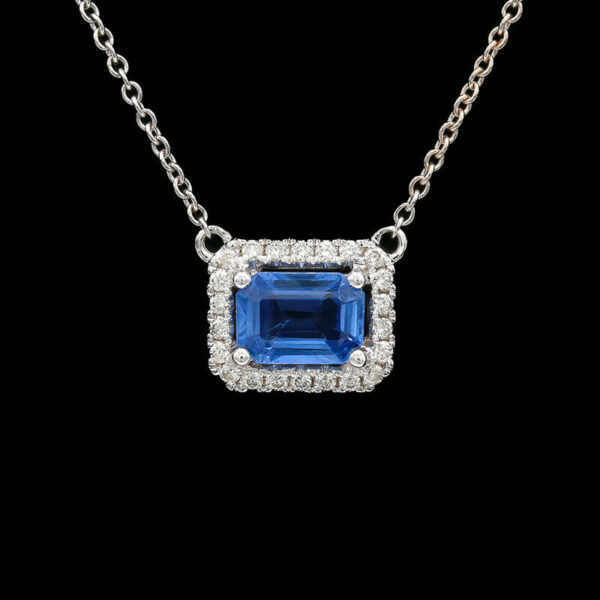 a blue and white diamond necklace on a chain