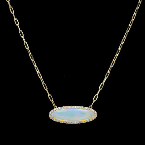 a necklace with an oval shaped opal and white diamonds