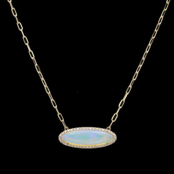 a necklace with an oval shaped opal and white diamonds