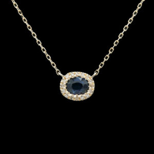 a necklace with a blue stone and white diamonds