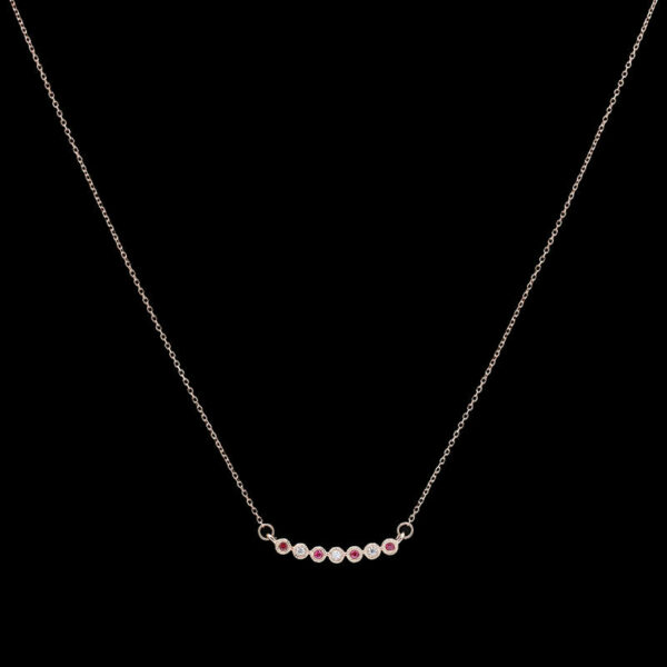 a necklace with five stones on it