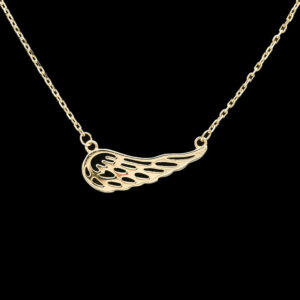 a gold necklace with an angel wing on it