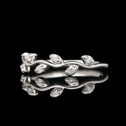 a white gold ring with diamonds on it
