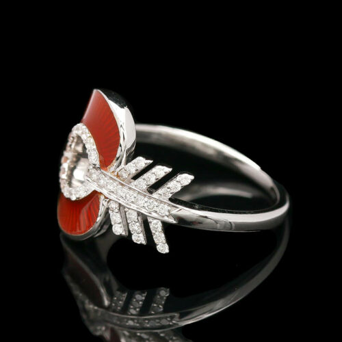 a red and white ring with diamonds on it