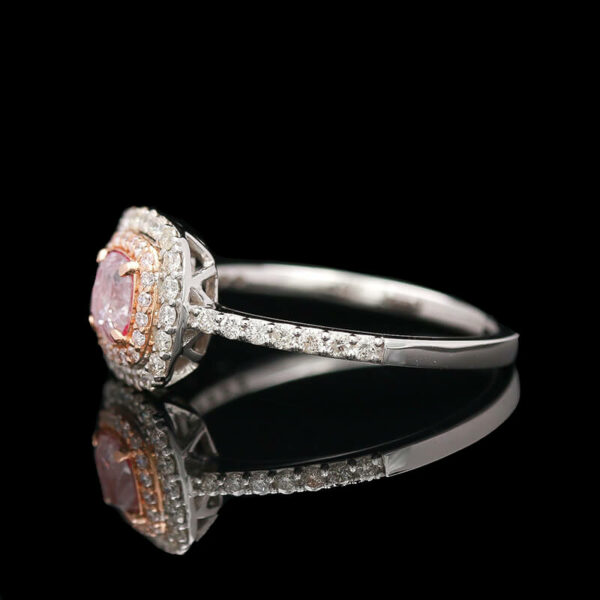 an engagement ring with a pink diamond and white diamonds