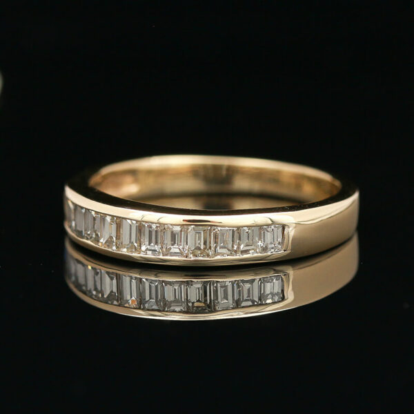 two wedding bands with baguettes on each side
