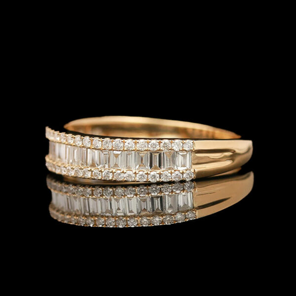 a gold ring with baguettes and diamonds