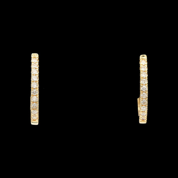 a pair of yellow gold earrings with diamonds