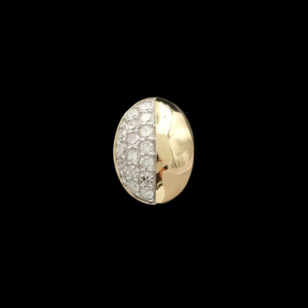 a gold and diamond ring on a black background