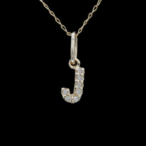 a gold necklace with the letter j on it