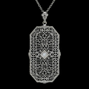 a pendant with an intricate design on it