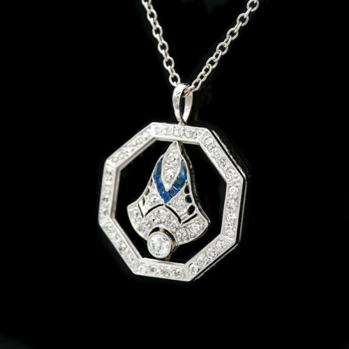 a diamond and sapphire pendant on a chain