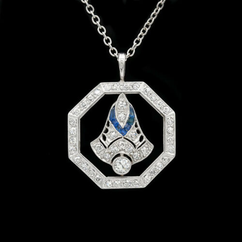 a diamond and sapphire pendant on a chain